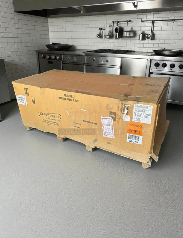 Henny Penny HHC-900 insulated holding cabinet, new in box, with SimpleHold controls, 120v, labels indicating fragile handling.
