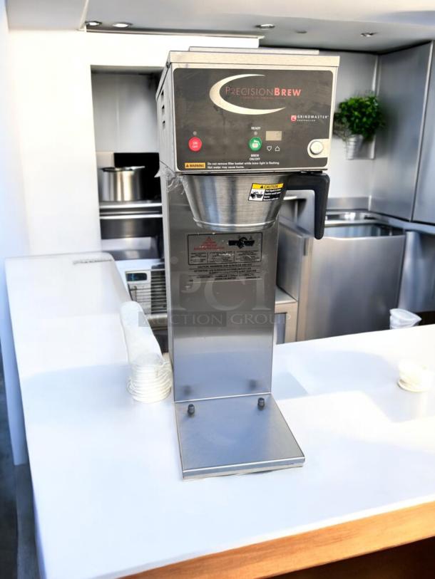 Like-new Grindmaster B-SAP PrecisionBrew digital coffee brewer in stainless steel, fully tested and working, with control panel.