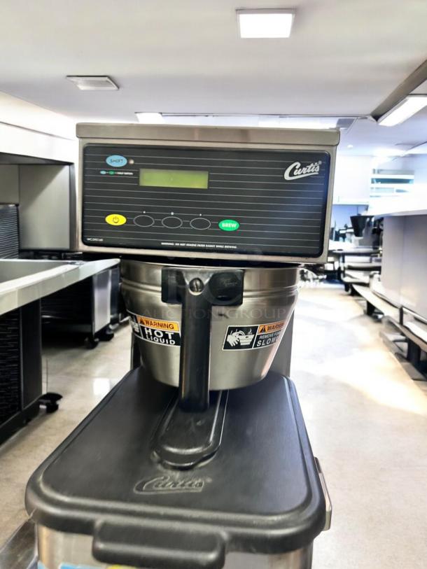 Immaculate Curtis TBP commercial iced tea brewer, 3.5-gallon capacity, fully tested, with warning labels, stainless steel.