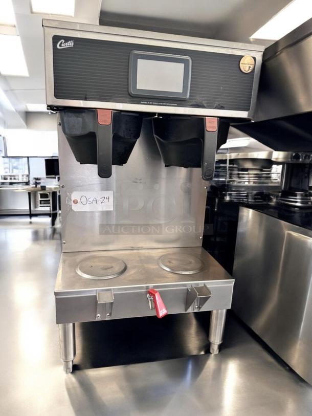 Curtis G4GEMT10A1000 twin coffee brewer with dual warmers, great condition, fully tested, visible Curtis logo and control screen.