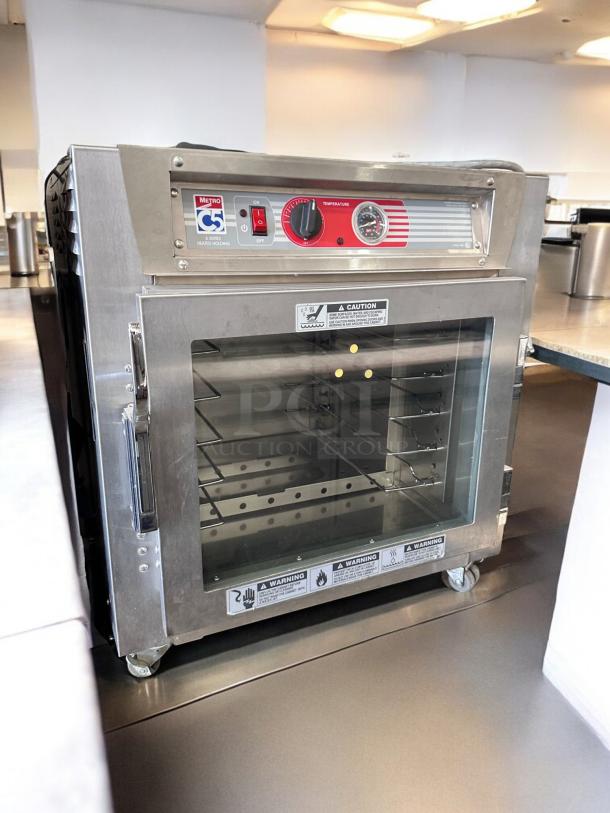 Metro C5 Heated Holding Cabinet, Model C5 63L-SFC-UA, stainless steel, outstanding condition, fully tested, on casters.
