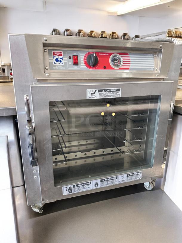 Metro C5 Heated Holding Cabinet, Model C5 63L-SFC-UA, outstanding condition, glass door, control panel, fully tested.