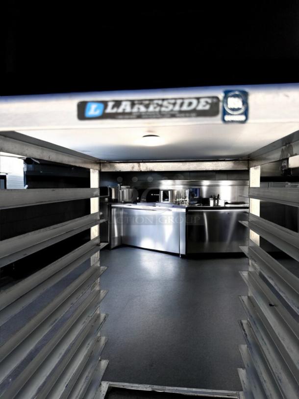 Lakeside stainless steel pan rack, excellent condition, 20 tray capacity, mobile, fully tested, Lakeside label visible.
