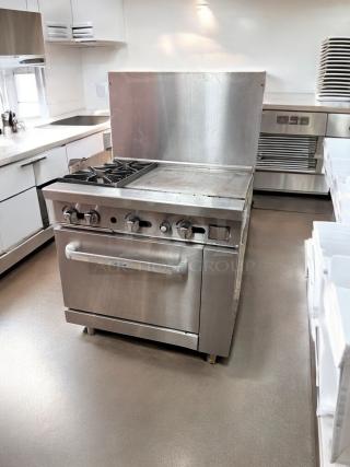 Commercial gas range in excellent condition with 2 burners, 24" griddle, and standard oven. Fully tested and working.