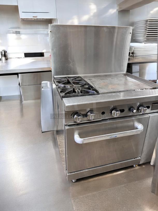 Commercial gas range in excellent condition with 2 burners, 24" griddle, and standard oven. Fully tested and working.