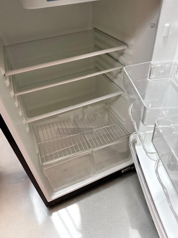 Magic Chef HVDR1040B refrigerator, 10.4 cu. ft., top freezer, black, excellent condition, glass shelves, tested and working.