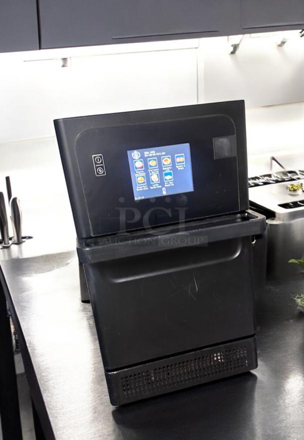TurboChef Sota high-speed oven, excellent condition, 208V, fully tested. Touchscreen interface shown, black exterior.