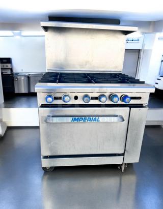 Imperial IR-6 36" gas range with 6 burners and oven, excellent condition, stainless steel, natural gas, fully tested.