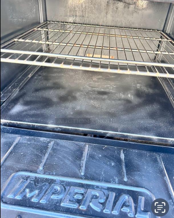 Imperial IR-6 36" gas range oven interior, clean with wire rack. Imperial logo embossed on the base. Excellent condition.