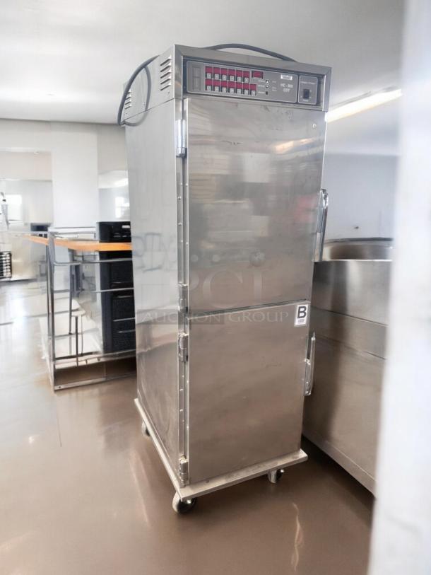 Henny Penny HC-900 Heated Holding Cabinet, excellent condition, 120V, stainless steel, on casters, visible control panel.