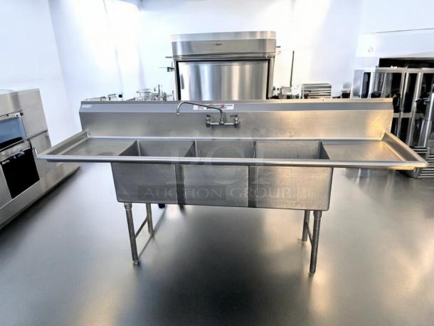 Stainless steel 3-compartment sink with dual drainboards, 96" x 31", excellent condition, fully tested and working.