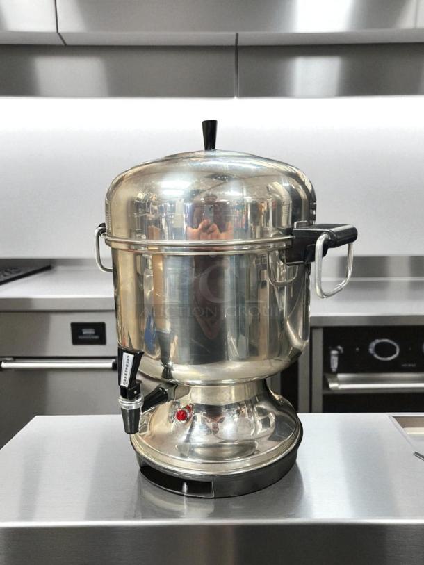 Farberware electric percolator model L-1360, 36-cup capacity, stainless steel, automatic, excellent condition, 120V, fully tested.