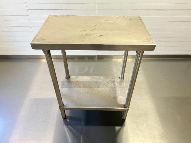 GSW heavy-duty stainless steel work table, 30” W x 18” D x 34” H, sturdy, used condition with shelf, ideal for kitchen or workshop.