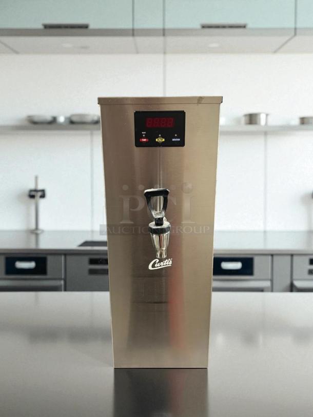 Curtis WB-5-GT digital hot water dispenser, 120V, in great condition. Features digital display, working order, branded tap.