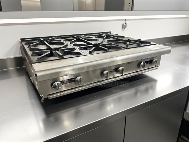 Imperial IR-4-C 24" countertop gas range with 4 open burners, heavy-duty cast iron, excellent condition, fully tested.