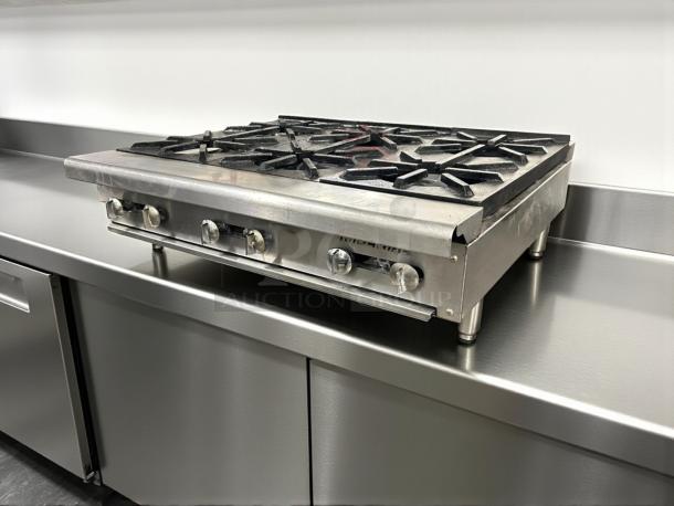 Imperial 24" countertop gas range, model IR-4-C, with 4 open burners, heavy-duty cast iron, excellent condition, fully tested.