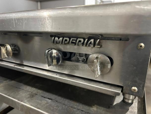 Imperial 24" countertop gas range, model IR-4-C, with 4 open burners. Heavy-duty cast iron, excellent condition.