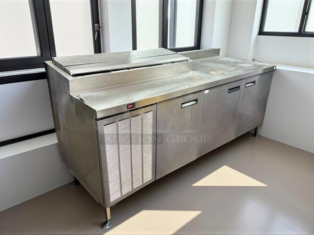 Delfield 000-20191PTC 91in 3-door refrigerated pizza prep table on casters, 115v, excellent condition.