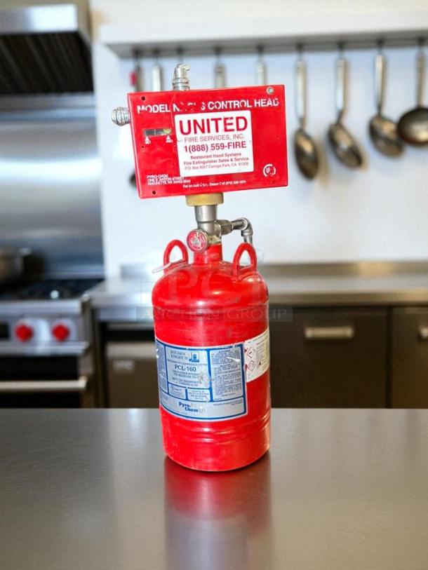 Pyro-Chem Kitchen Knight II 1.6 Gallon Cylinder, red, great condition with control head and service label visible.