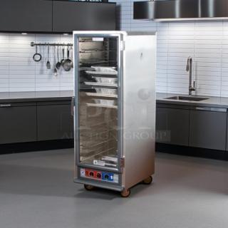 Metro C519-CFC-U heated proofing cabinet with clear door, good condition, tested working, multiple shelves, on casters.