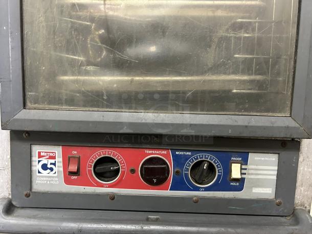 Metro C519-CFC-U non-insulated heated proofing cabinet with clear door, tested and working. Control panel shows temperature and moisture settings.