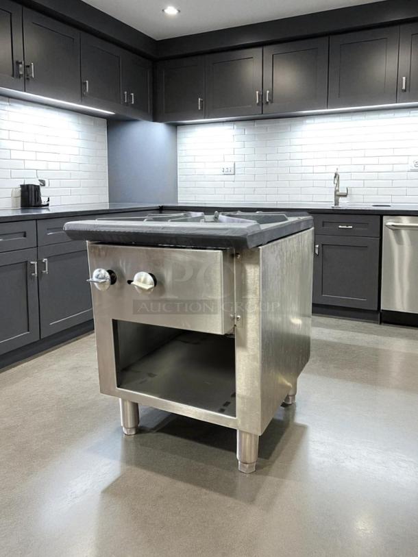 Commercial stock pot gas burner, 3-ring, in excellent condition with two control knobs and storage space, tested and working.
