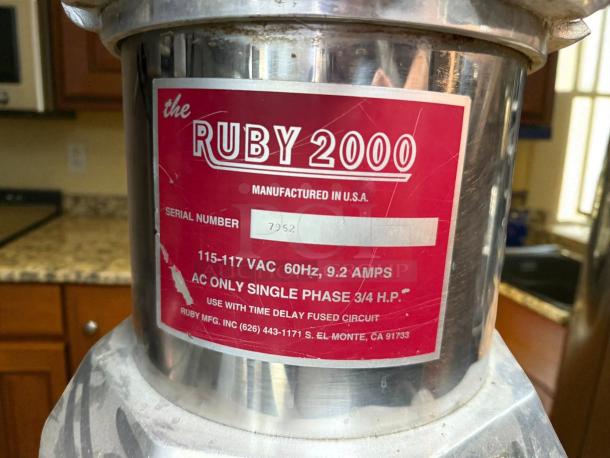 Ruby 2000 Commercial Juice Extractor, stainless steel, tested and working. Label shows 115-117V, 60Hz, 9.2A, 3/4 HP. Serial 7952.