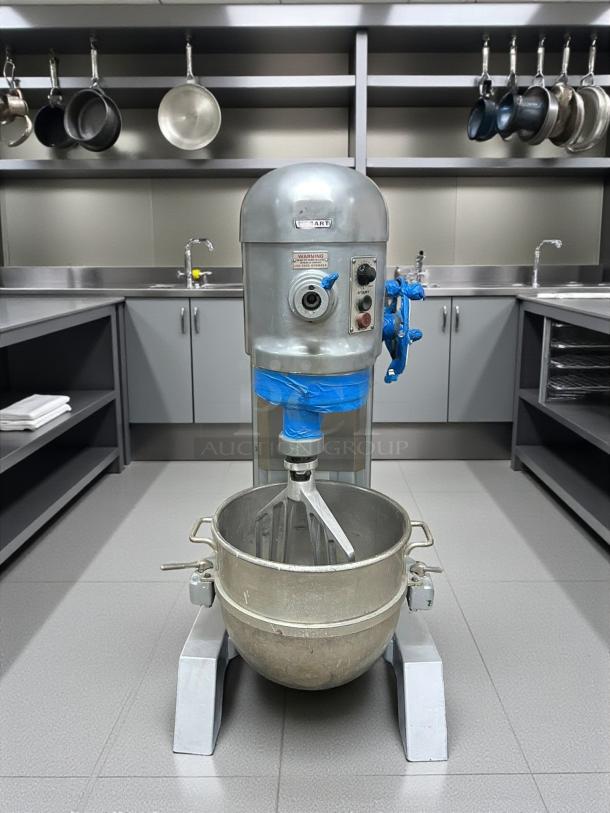 Hobart Model H600T 60QT Dough Mixer, silver, 220/240v, excellent condition, visible control panel and mixer bowl, industrial setting.
