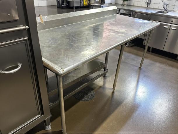 L&J Model SG3684-RCB 88" stainless steel work table with crossbar, open base, in great condition; ideal for bakeries.