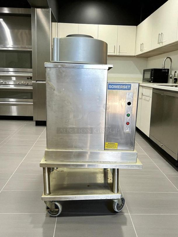 Somerset SDR-400 dough rounder, 110V, excellent condition, tested and working, stainless steel, on wheeled stand.