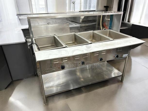 Avantco STE-4SGA electric steam table with four pans, undershelf, overshelf, and sneeze guard, 120V, tested and working.