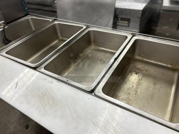 Avantco STE-4SGA four-pan electric steam table with undershelf, overshelf, sneeze guard; 120V, tested, working condition.