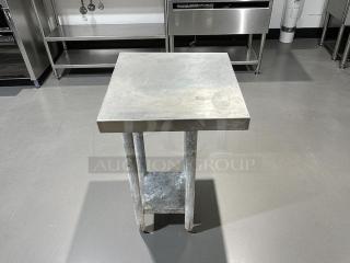 GSW stainless steel worktop table with galvanized bottom shelf, in good condition. Sturdy design, ideal for kitchens.