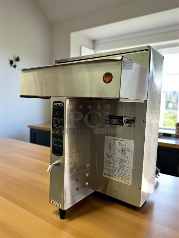 Fetco CBS-2032e Coffee Brewer, immaculate condition, twin 1-gallon, stainless steel, tested, 120/208 volts, visible labels.