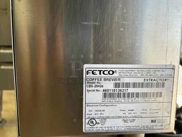 Fetco CBS-2042e coffee brewer, twin 1-gallon model, in excellent condition. Includes manufacturer's label with serial number.