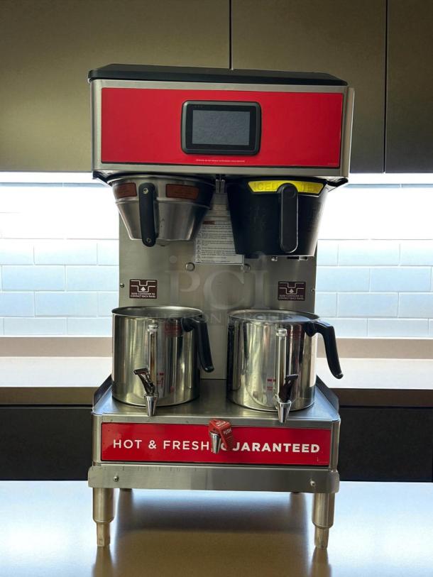 Wilbur Curtis G4GEMT10A1000 dual automatic coffee brewer, excellent condition, 220V, with dual brew baskets and dispensers.