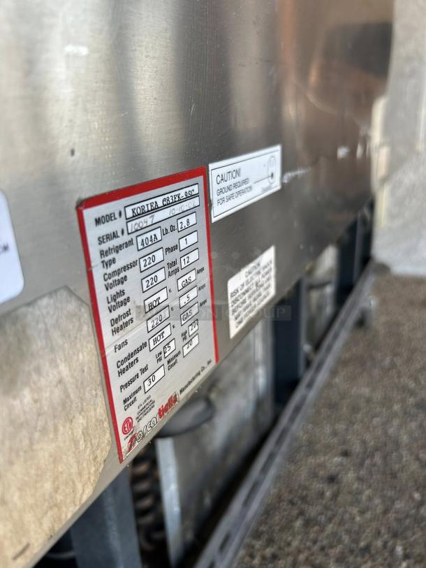 Oscartielle Model C83FK-9SC gelato case label, showing specifications for 220V operation and refrigerant type.