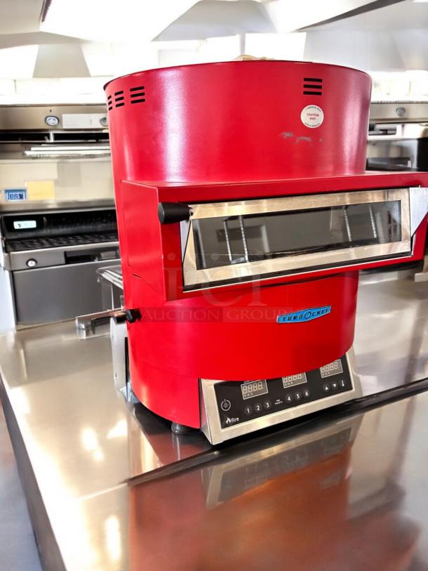 Red TurboChef Fire high-speed pizza oven in excellent condition, 240V, fully tested and working, stainless steel accents.
