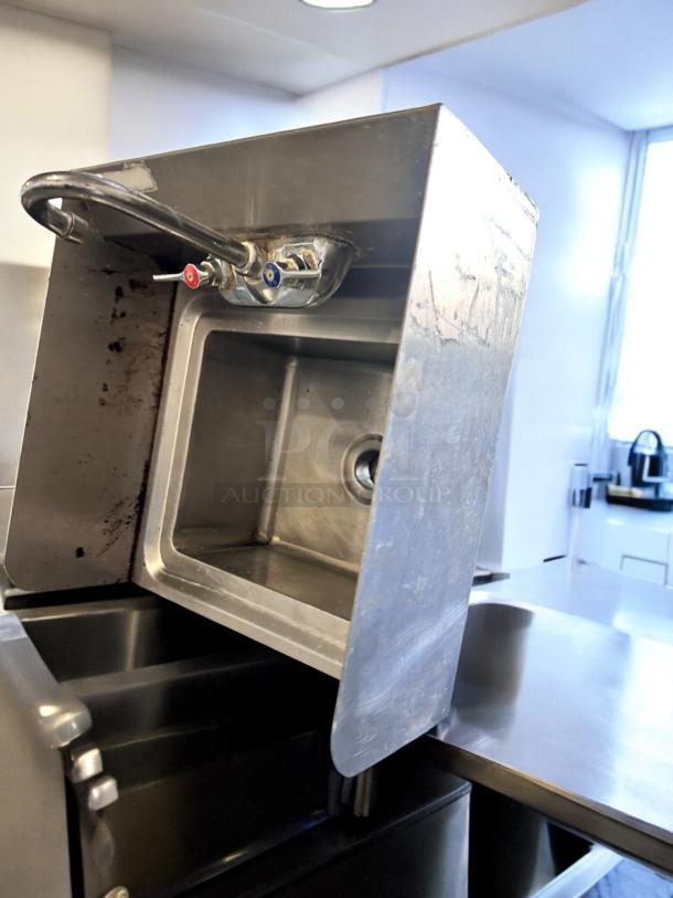 Stainless steel wall-mount hand sink with faucet, excellent condition, fully tested and cleaned, model Wall-Mount Hand Sink.