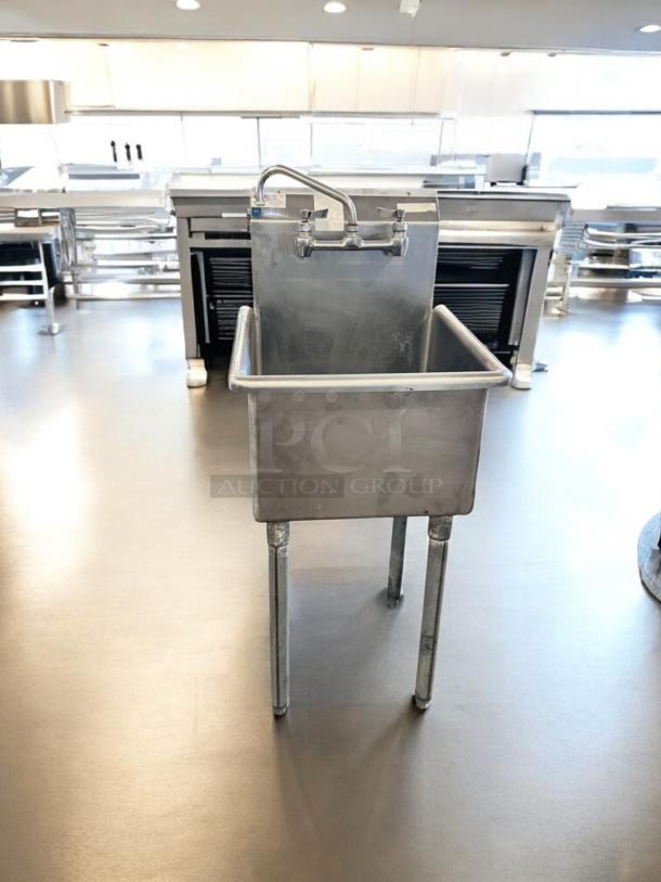 Heavy-duty stainless steel utility sink, single compartment, outstanding condition, fully tested, functional, industrial setting.
