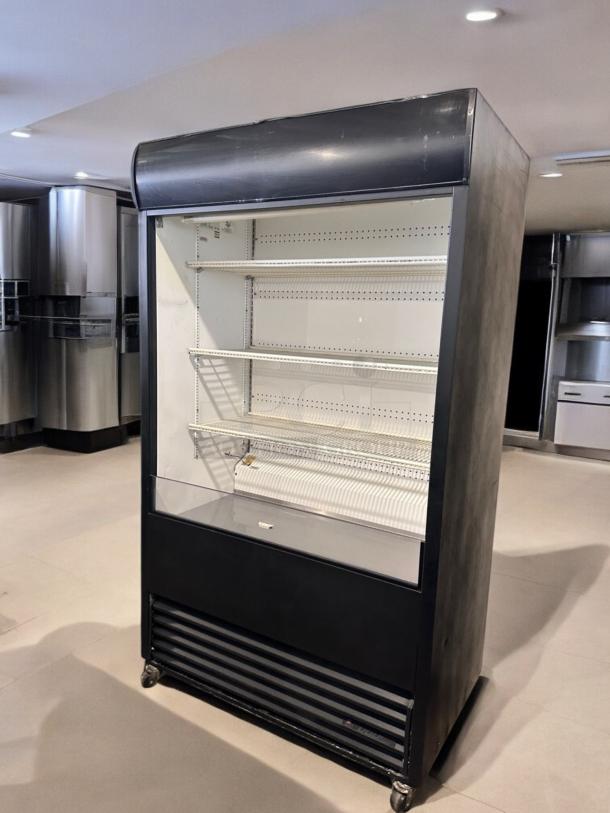 True TAC-48 air curtain merchandiser in excellent condition, 208/230V, fully tested. Black exterior, glass front, shelves intact.