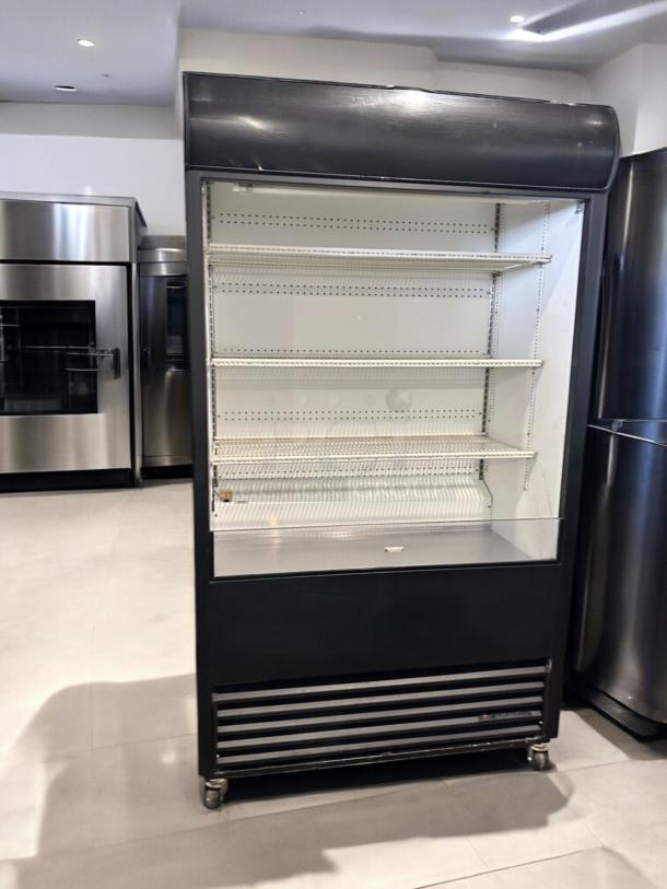 True TAC-48 air curtain merchandiser in excellent condition, 208/230V, with adjustable shelves, fully tested and working.