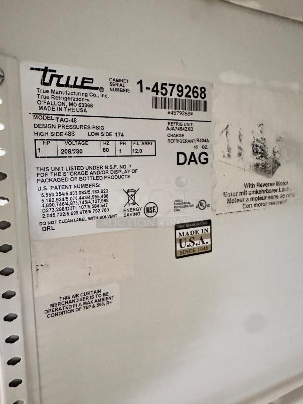True TAC-48 air curtain merchandiser tag showing model and voltage details; in excellent condition; made in USA.