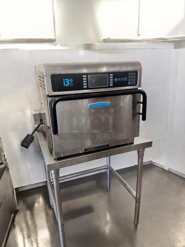 TurboChef I3 high-speed convection microwave oven in excellent condition on a stainless steel stand; 208/240V; fully tested.