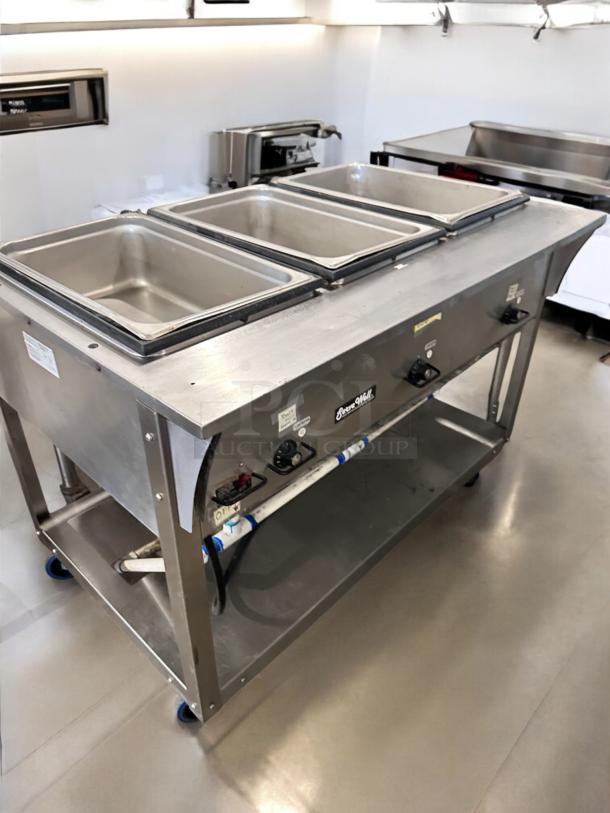 Vollrath ServeWell 387013, 3-well steam table, 120V, excellent condition, fully tested, stainless steel, on wheels.
