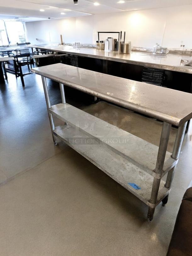 Stainless steel work table, 60" x 18", excellent condition, two undershelves, fully tested, operational.