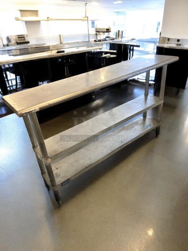 Stainless steel work table, 60"x18", excellent condition, with 2 undershelves. Fully tested and operational.