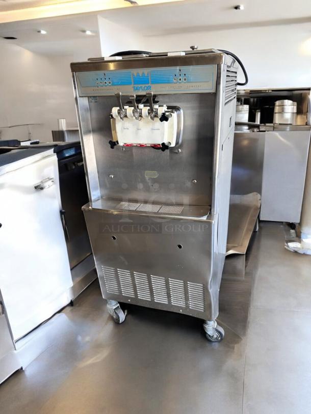 Taylor Y339-27 soft serve ice cream machine, excellent condition, 208/230V, fully tested, stainless steel finish, on wheels.