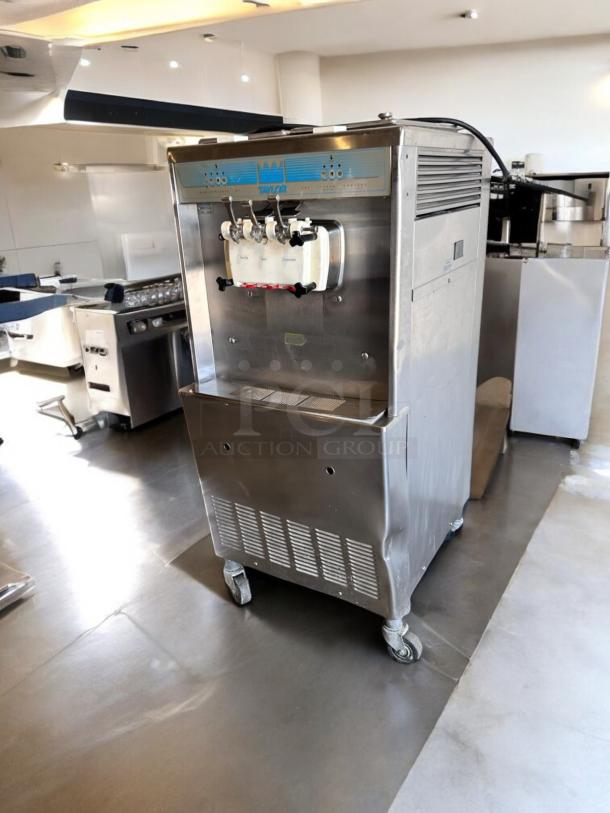 Taylor Y339-27 soft serve ice cream machine, excellent condition, 208/230V, stainless steel, fully tested, on caster wheels.
