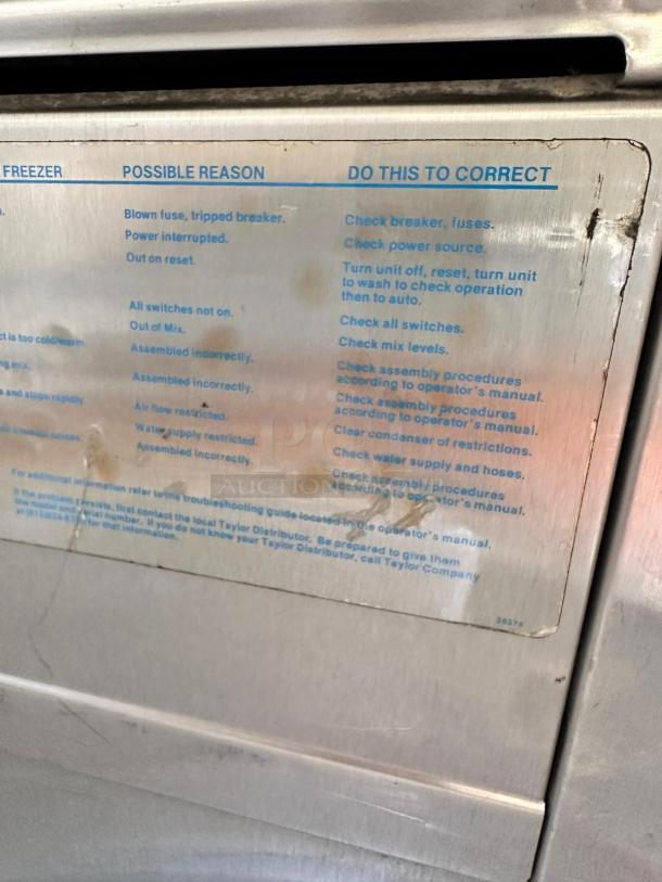 Taylor Y339-27 soft serve ice cream machine, excellent condition, 208/230V, troubleshooting label visible, fully tested.